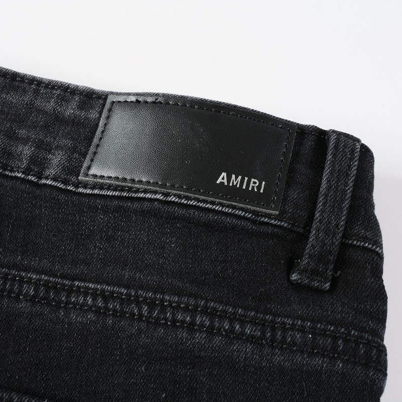 AMIRI Patchwork Slim Jeans – Full Logo Distressed Denim